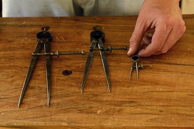 Three Antique Compass Dividers On A Woodworking Moravian Workbench