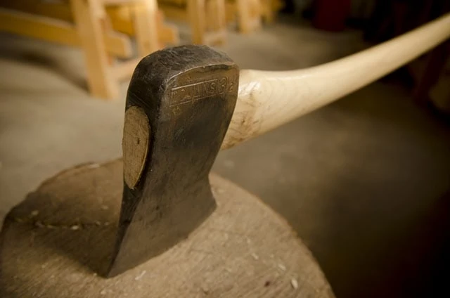 Collins 3 1/2 Pound Axe Head On An Axe Handle Buried In A Stump