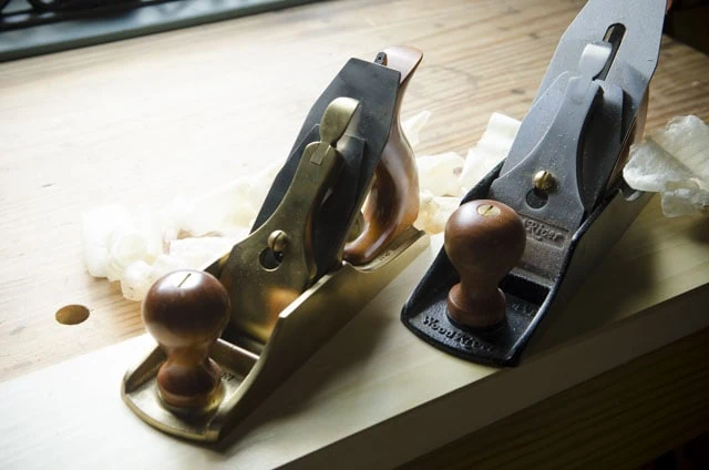 Lie-Nielsen Smoothing Plane Next To A Woodriver 4 1/2 Smoothing Plane With Wood Shavings