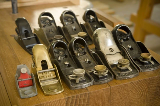 A Bunch Of Woodworking Block Planes Sitting On A Moravian Workbench