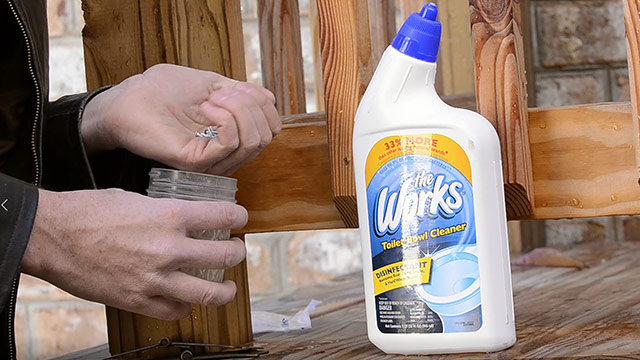 Pouring The Works Toilet Bowl Cleaner Into A Glass Jar To Strip Zinc Plating From Slotted Screws To Get Historical Wood Screws