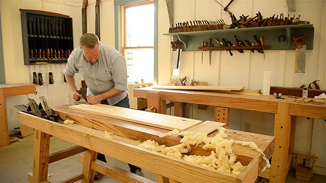 Joshua Farnsworth Handplaning A Large Board On A Moravian Workbench