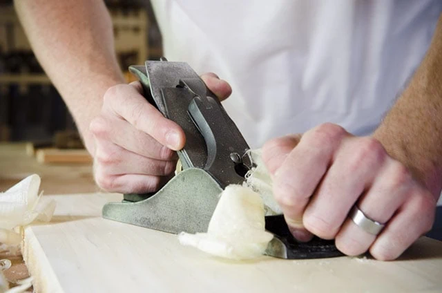 Man Using A Stanley No. 4 Smoothing Plane To Smooth A Poplar Board