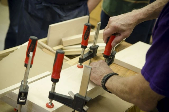 F Style Woodworking Clamps Used To Glue Up A Donkey'S Ear Shooting Board