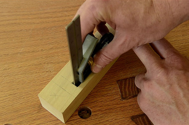 Using A Combination Square As A Depth Gauge On A Table Leg Mortise Joint