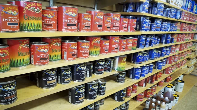Woodworking Store Shelves Full Of Cans Of Wood Finish