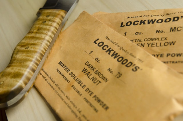 Lockwood'S Water Soluable Dye Powder For Woodworking With A Tiger Figured Maple Knife