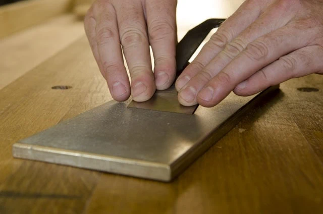 Honing Or Sharpening A Hand Plane Iron Blade On A Diamond Stone
